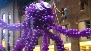 giant purple balloon octopus suspended from Science Center ceiling