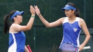 Carina Chen and Sojung Lee high five on tennis court