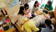 students playing cards in dorm room