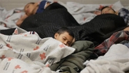 Getty image: children sleeping in refugee center