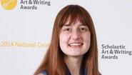 Elizabeth Engel poses at banner for Scholastic Art & Writing Award