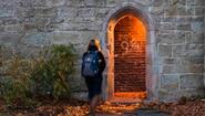 student heads into archway labeled platform 9-3/4 at dusk