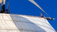 Sophia Sokolowski high in the rigging of sailboat