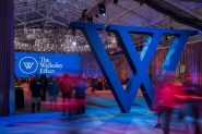 An interior photo of the Wellesley fieldhouse decorated for the launch of the Campaign for Wellesley