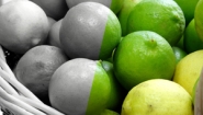 Photo of limes, half of the image is in color half is black and white