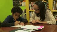 Wellesley student works with elementary student at desk