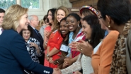 Hillary Clinton greets emerging women leaders from around the world