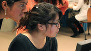 Wellesley students look at computer screen