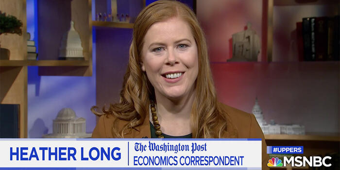 A woman speaks to a camera.