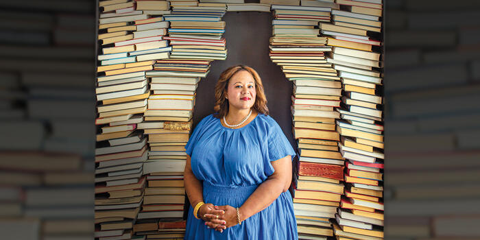  Jasmine Guillory ’97 photographed in front of stacks of books.