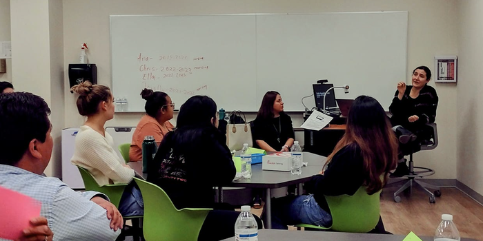 Professor Kathya Landeros speaks to students.