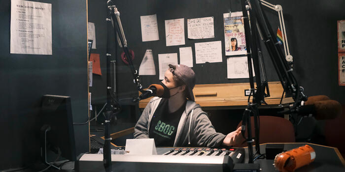 Molly McCaul sits in the WZLY studio.