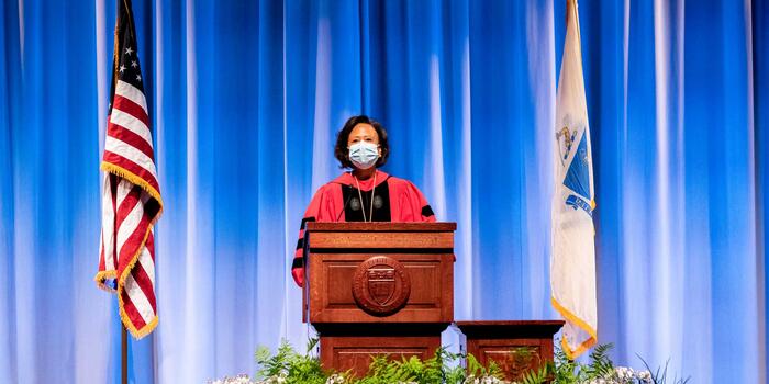 Paula Johnson speaking at podium