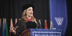 Michigan Secretary of State Jocelyn Benson speaks from behind podium at Wellesley College commencement