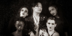 The Kit Kat Girls and their Emcee from the musical Cabaret