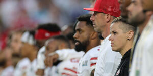 Katie Sowers stands amongst her team