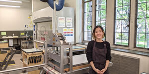 Rinako Sonobe stands in the printshop in Pendleton West