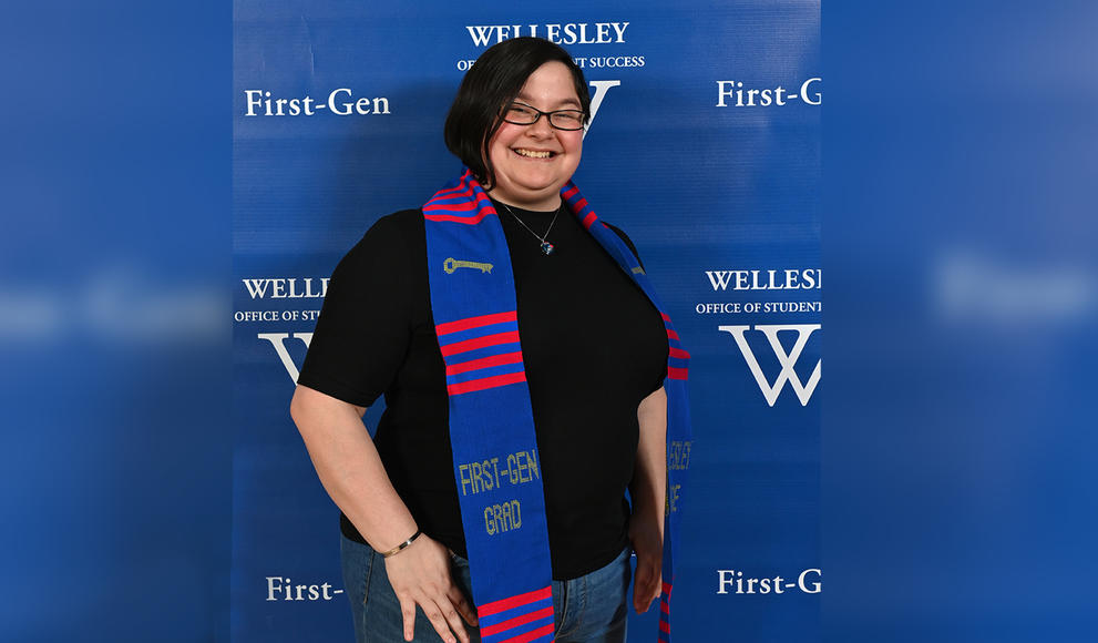 Mikhaela Andersonn poses with her First-Gen stole around her shoulders. 