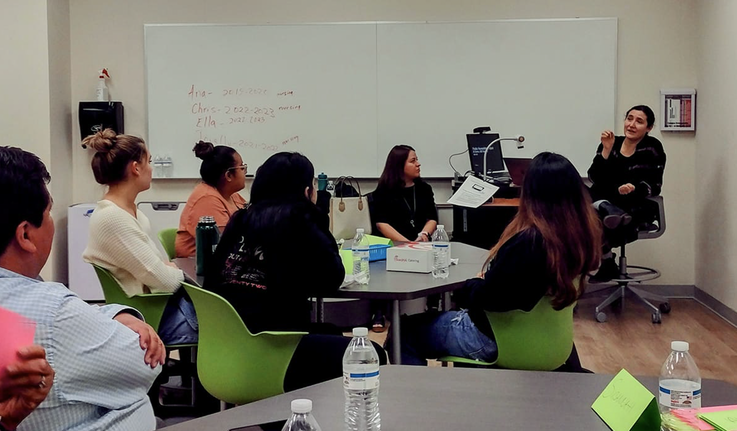 Professor Kathya Landeros speaks to students.