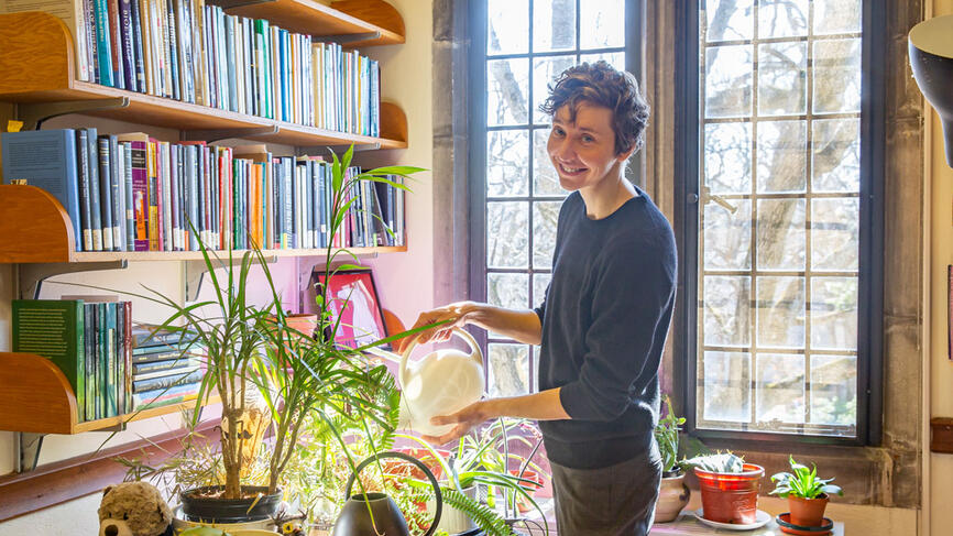 A professor waters her plants