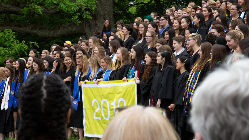 The Class of 2019 lines up for a photo on severance green. 