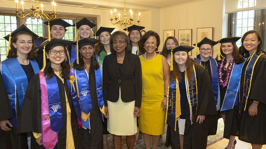 Students pose with Anita Hill and President Johnson before the ceremony