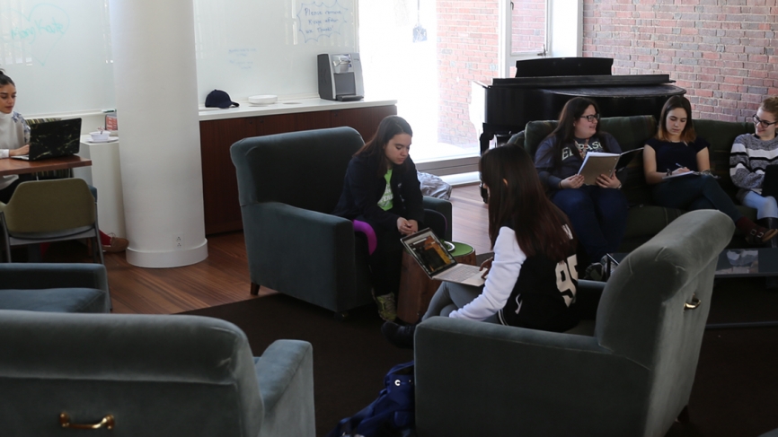 Farther east, past the Science Center, students gather at lunchtime in the renovated Freeman living room. 