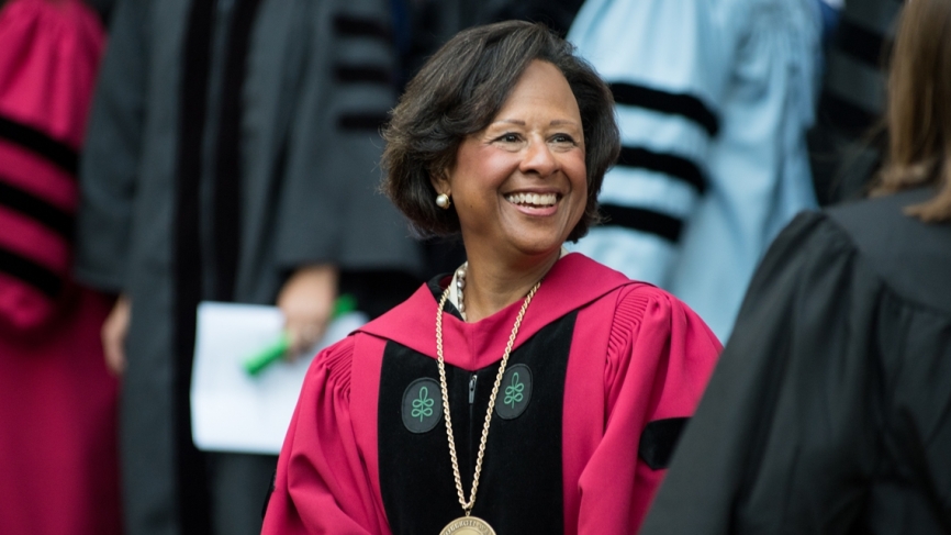 President Paula A Johnson smiles from her seat at convocation