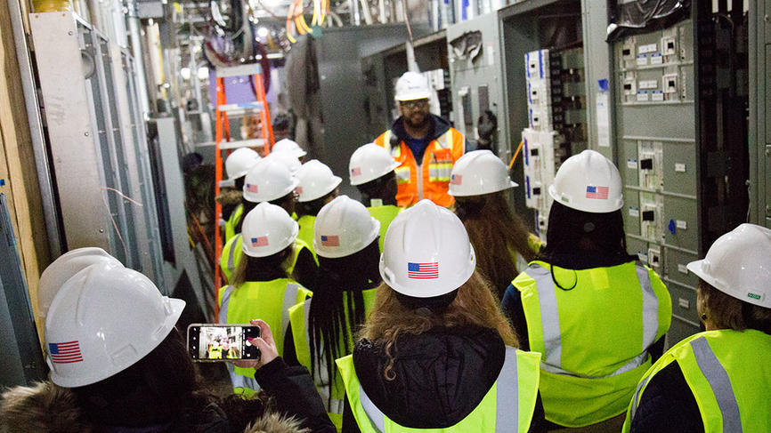 A superintendent for Turner construction leads a tour through the Science Center