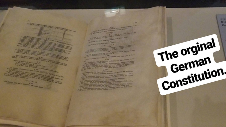 Image of the original German constitution at the German Historical Museum in Berlin. Text reads The original German Constitution