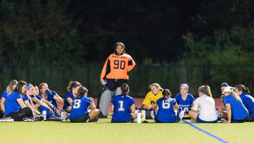 wellesley field hockey team in huddle