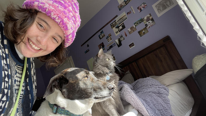 Hannah Whellan poses with her dog and cat.