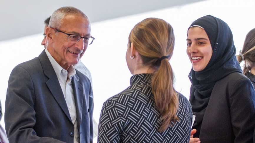 John Podesta speaks to two Albright Fellows.