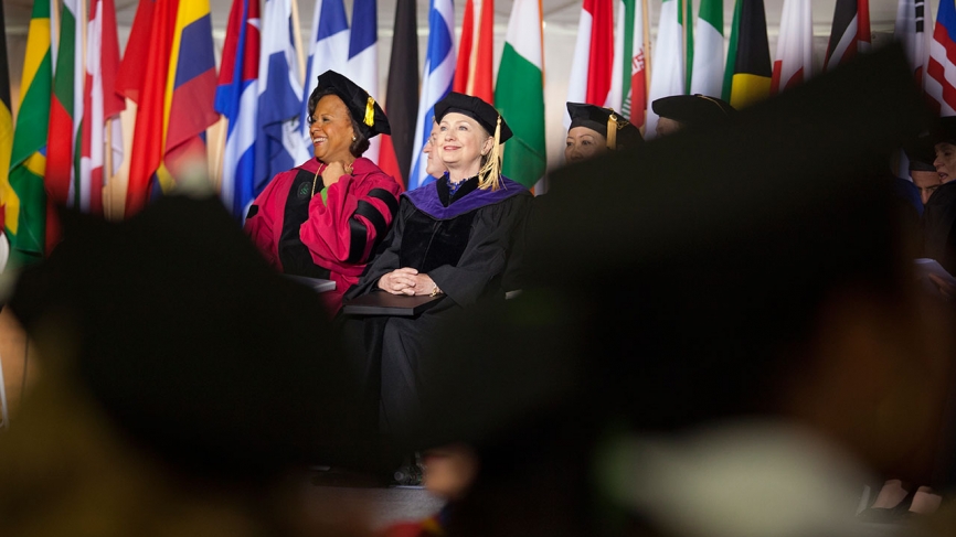 President Johnson and Secretary Hillary Clinton talking at Wellesley's Commencement