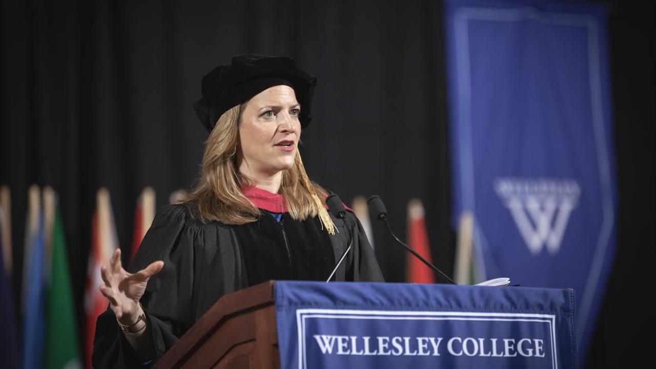 Michigan Secretary of State Jocelyn Benson speaks from behind podium at Wellesley College commencement