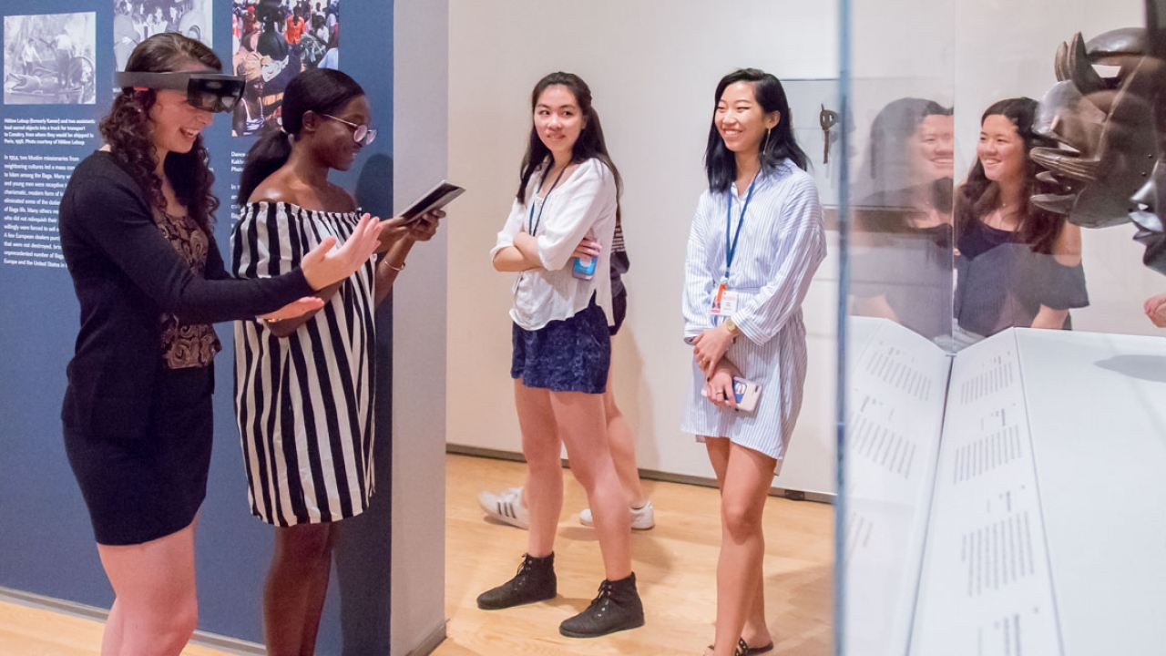 Student Interns use augmented reality technology at the Davis Art Museum.