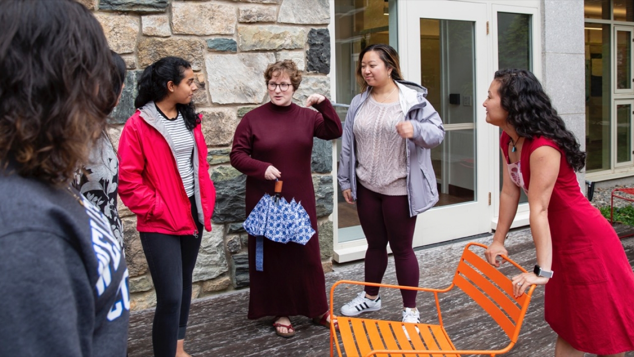 Helen Wang talks with a group of students outside Bates Hall.