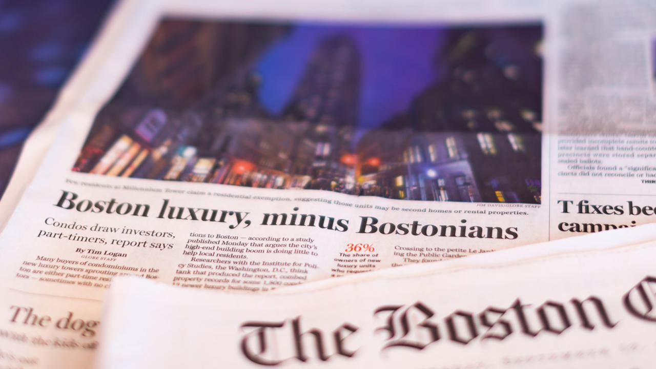 The front page of the Boston Globe, which reads "Boston Luxury, Minus Bostonians."