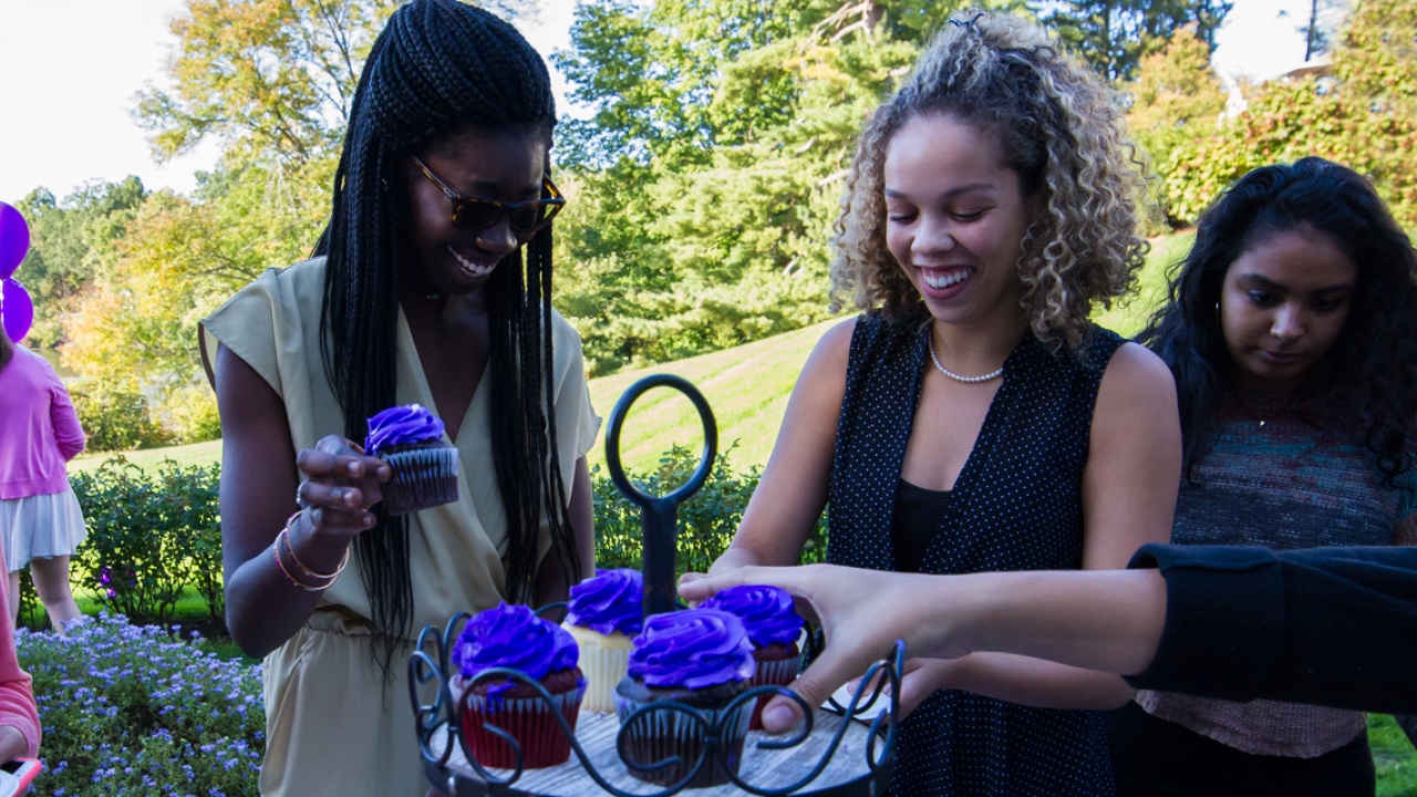 The "purple" Class of 2018 enjoy purple cupcakes at the annual senior class reception.
