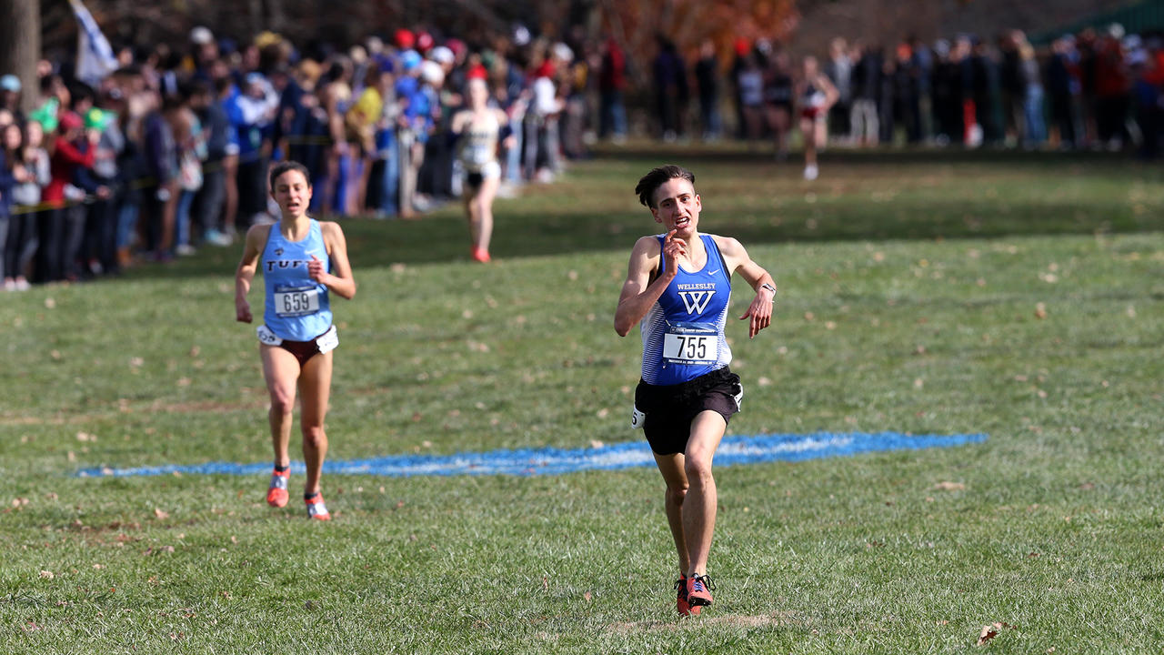 Senior Ari Marks sprints toward the finish line during a cross country competition.