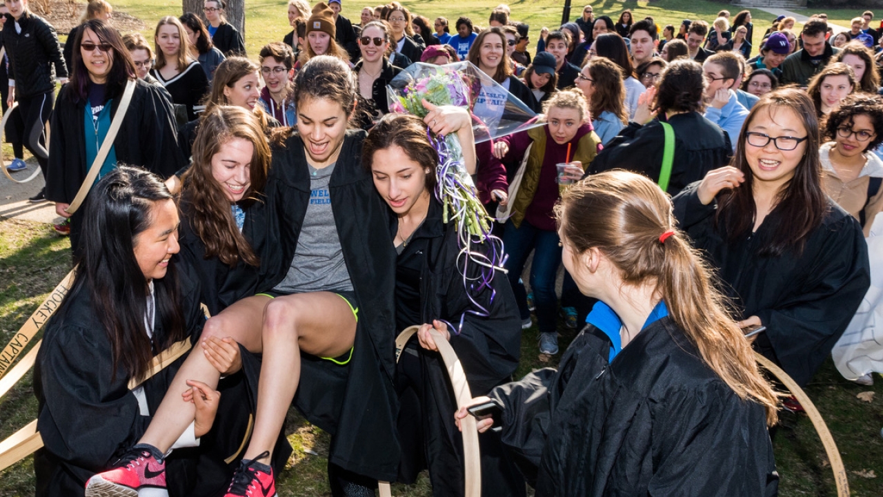 Emily Hamilton is carried by classmates after winning the 2018 Hooprolling competition. 