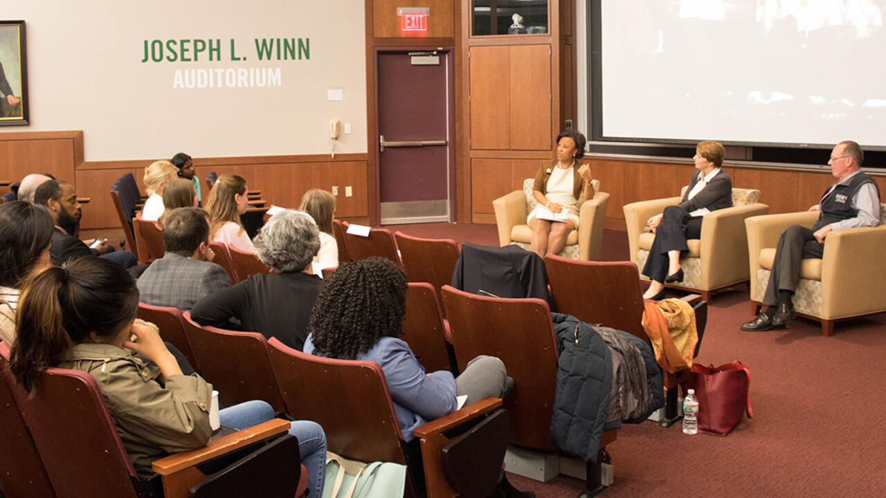 President Paula A. Johnson moderates a discussion with Paul Farmer and Ophelia Dahl, Partners in Health founders.
