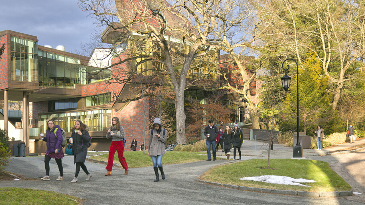 people walking across campus in front of the Lulu