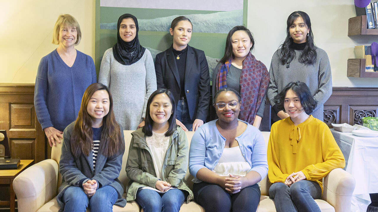 Students and faculty pose together. 