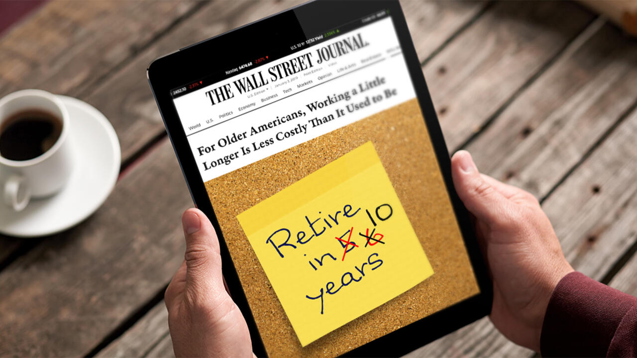 A person holds a tablet. It reads " For older Americans, Working a Little Longer is Less Costly Than it  Used to Be"