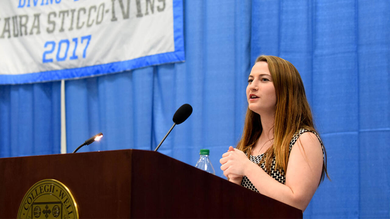Maura Sticco-Ivins '18 speaking at podium