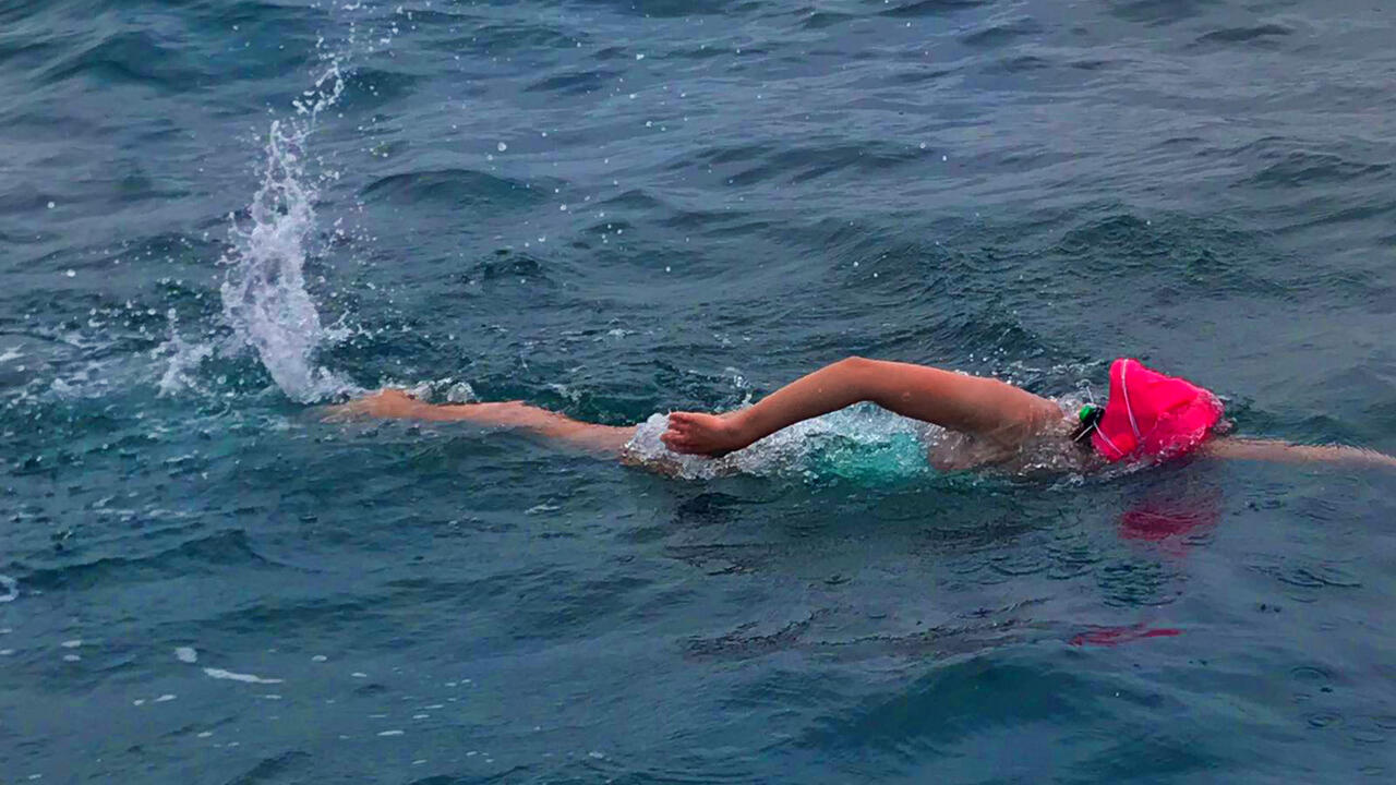 An alumna swims in the English Channel.
