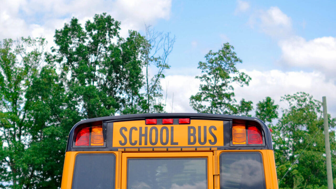 The outside view of the back of a school bus.