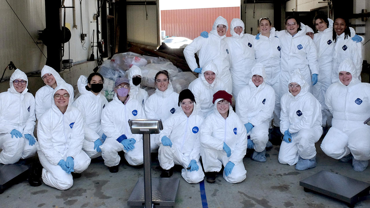 Students pose in their hazmat suits.