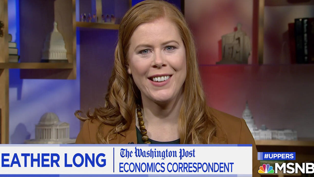 A woman speaks to a camera.